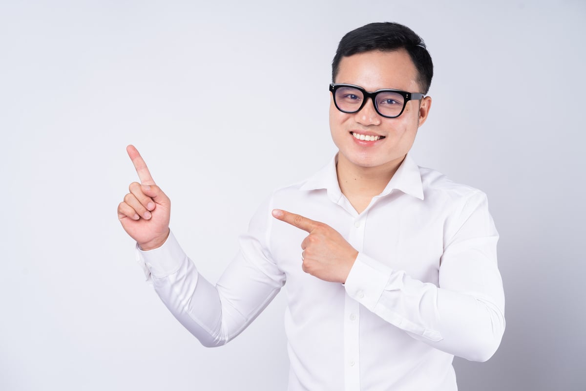 Image of Asian Businessman Pointing up